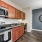 a kitchen with wooden cabinets