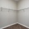 a white wall with a metal bar
