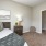 a bedroom with a bed and a lamp