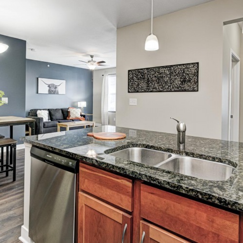Settle into comfort at Residences on Ronald Reagan a kitchen with a large island