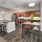 a kitchen with a bar stool and a table